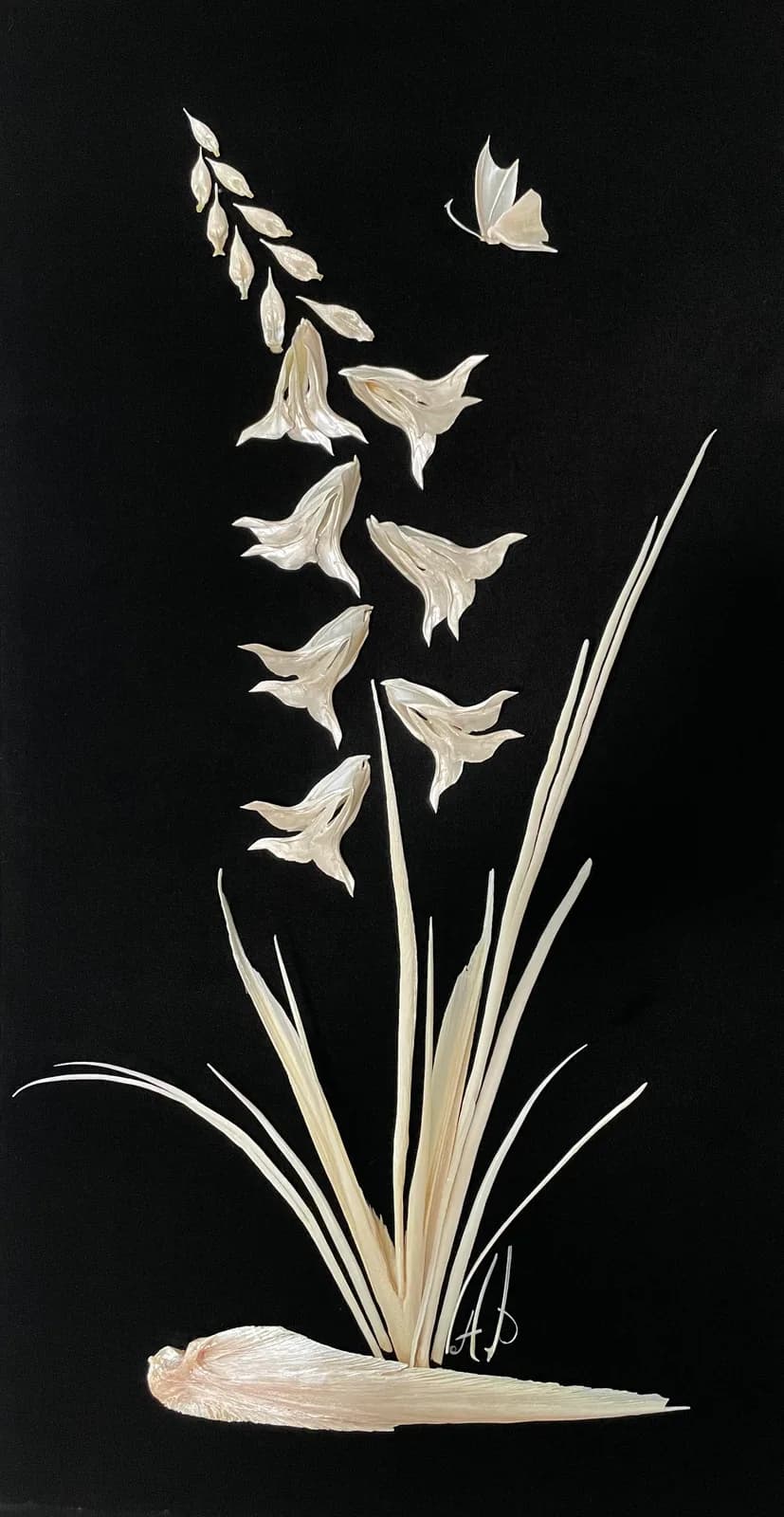 A delicate mixed media artwork features white bellflowers and a butterfly against a black background.