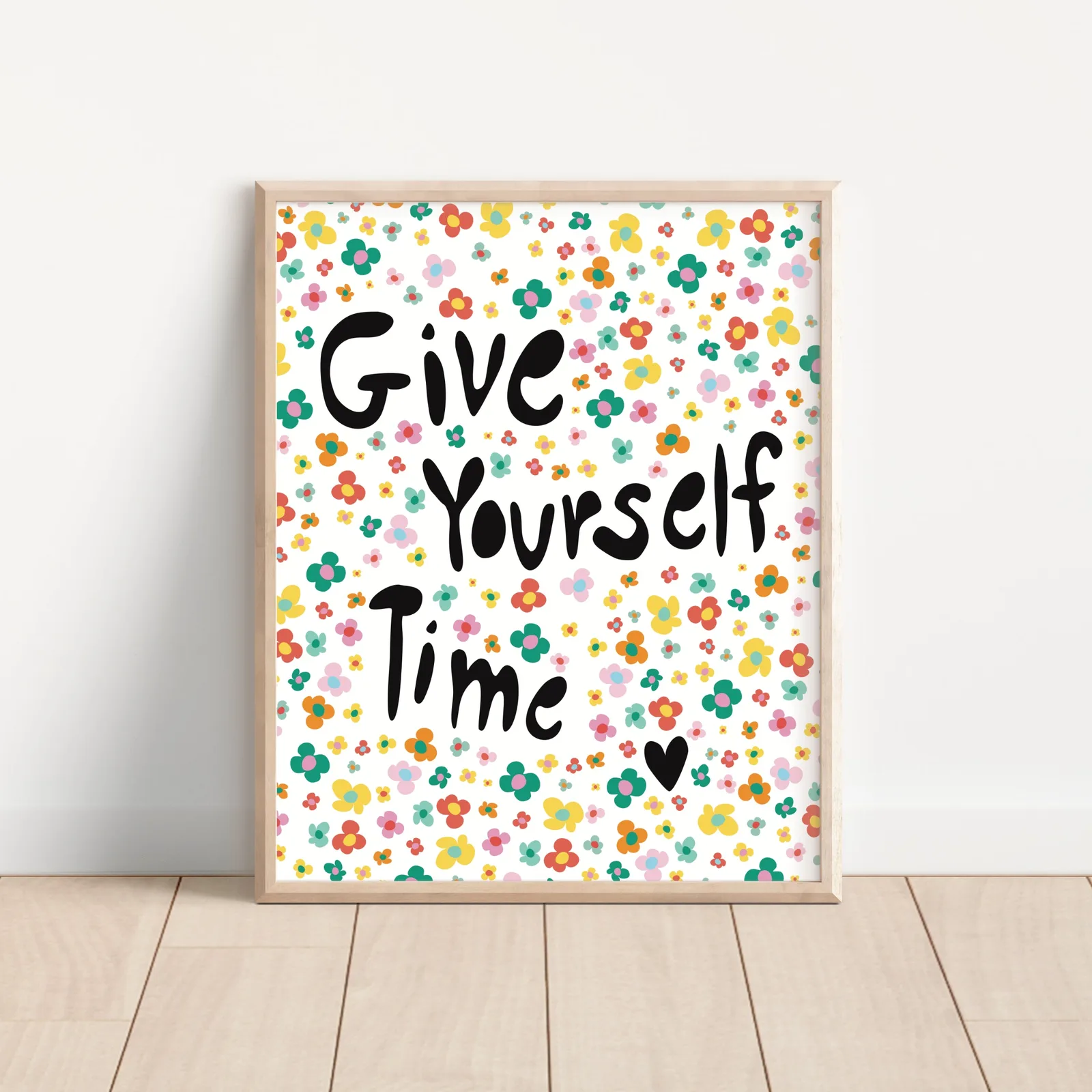 A framed print with a floral pattern and the quote "Give Yourself Time" in black lettering, rendered in oil and acrylic.