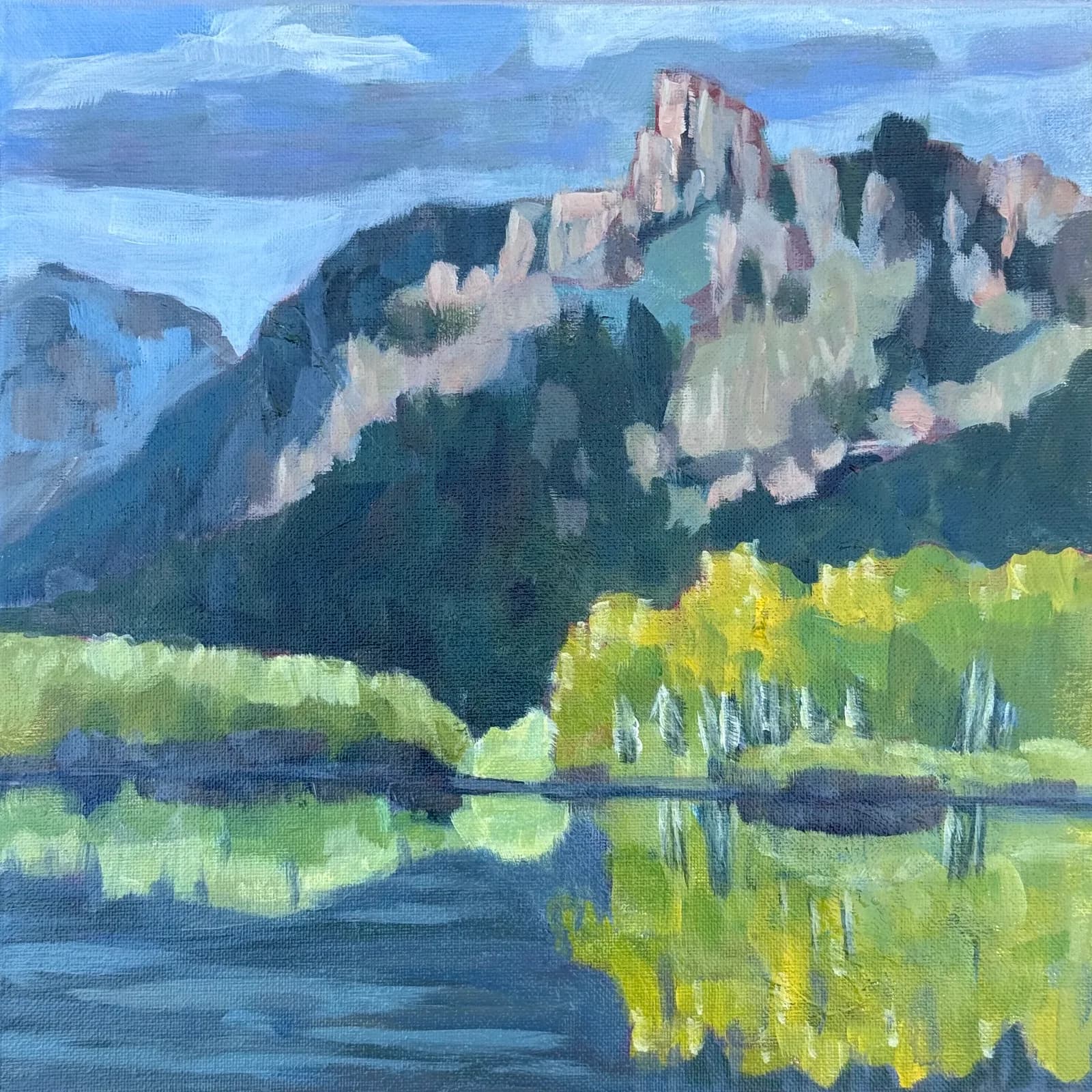 An impressionistic oil painting depicts the Flatirons mountains reflected in a lake with vibrant green trees.