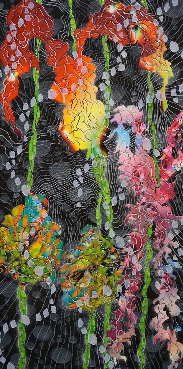 Abstract textile art depicting vibrant irises with organic shapes and a dark background.
