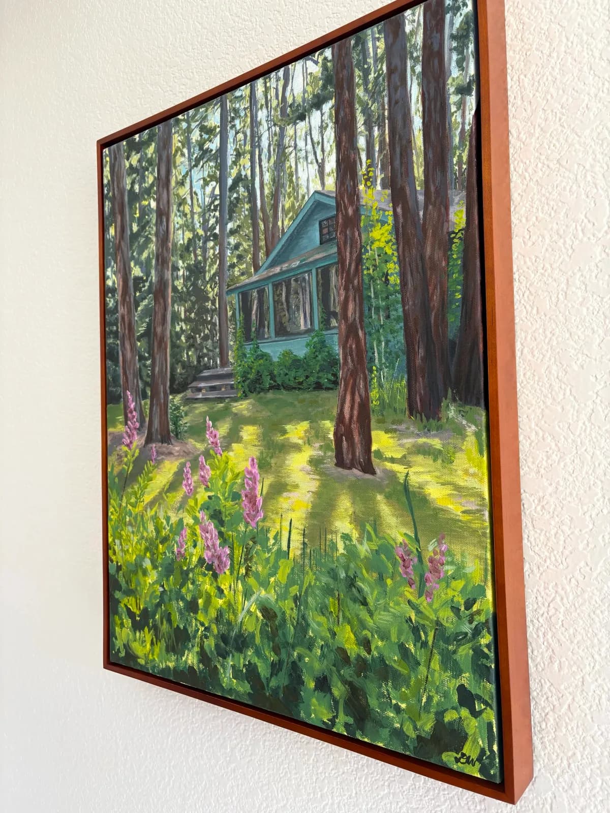 An impressionistic oil painting depicts a cabin nestled in a sun-dappled forest with vibrant wildflowers in the foreground.