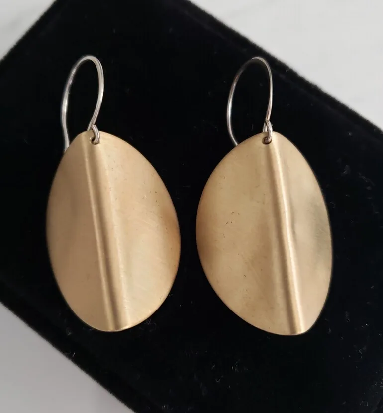 Hidden artwork image, brass-shield-smooth-3 by Elizabeth Woody