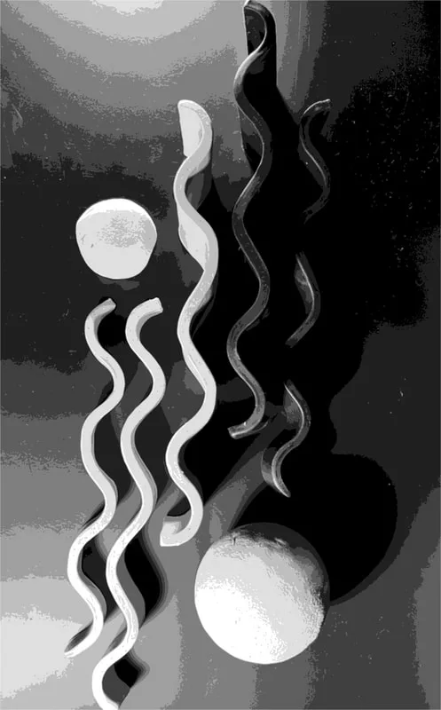 Abstract metal sculpture featuring curved forms and spheres in shades of gray and black.