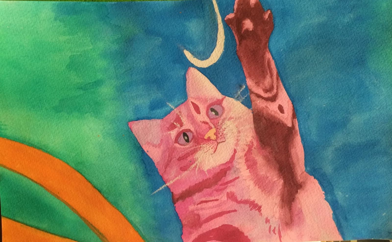 A pink cat playfully reaches for a white object in this expressive watercolor painting with a vibrant blue and green background.