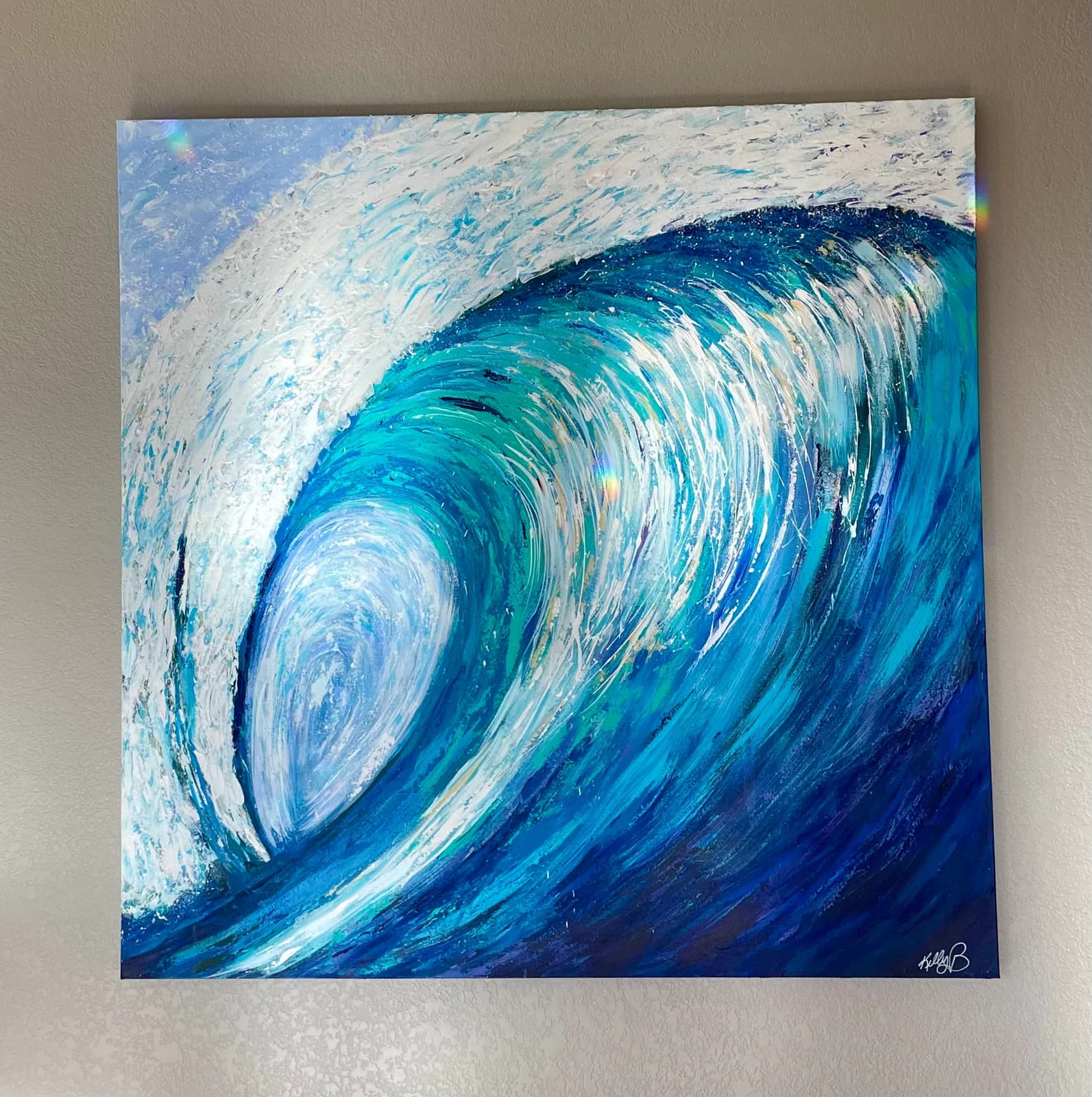 An expressive oil and acrylic painting captures a powerful ocean wave in shades of blue and white, with textured brushstrokes.
