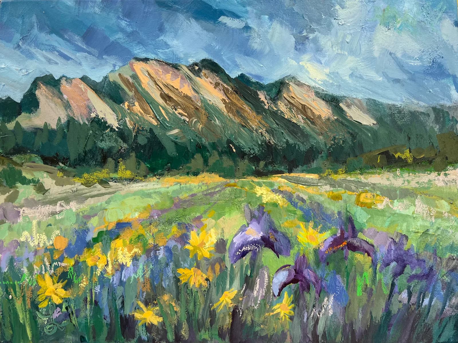 An impressionistic oil painting depicts the Flatirons mountains above a field of yellow and purple wildflowers.