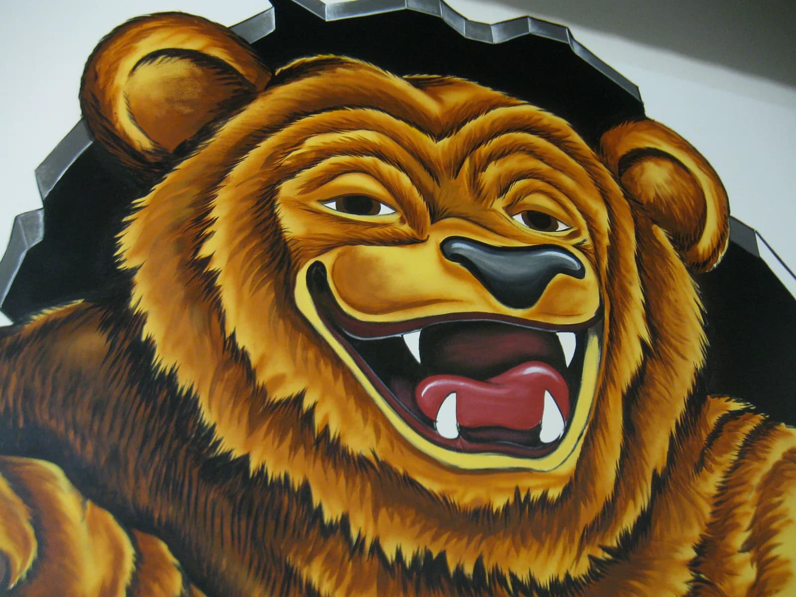 A cartoon bear with a wide grin and sharp teeth is depicted in oil and acrylic paint.