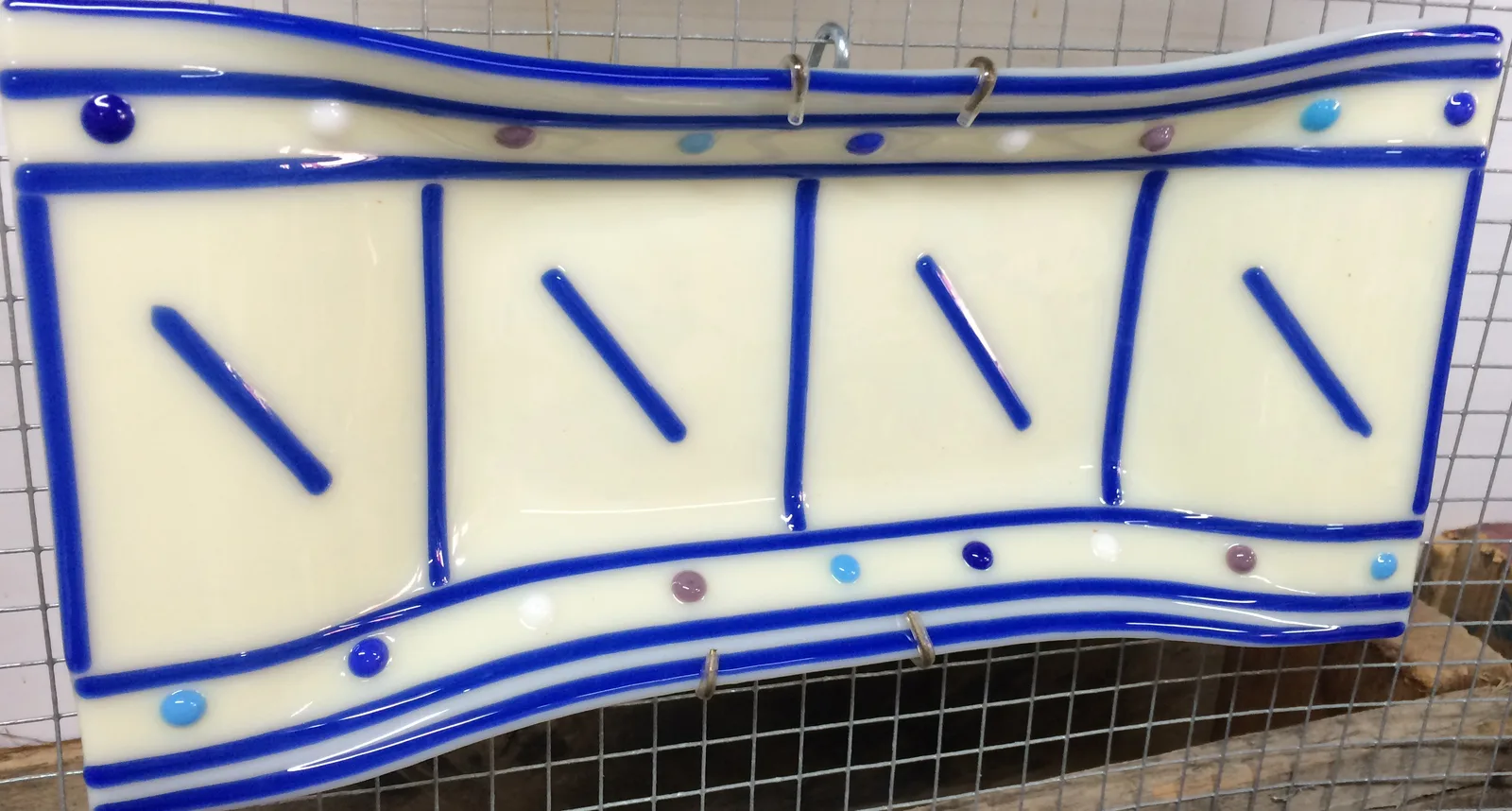 blue and white plate with stripes by Minna Vallentine