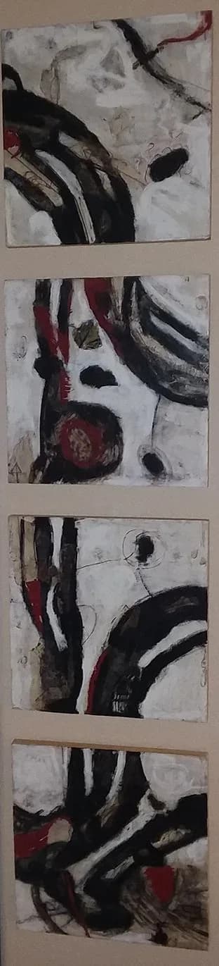 Abstract oil and acrylic paintings with bold black and red marks on a neutral background.