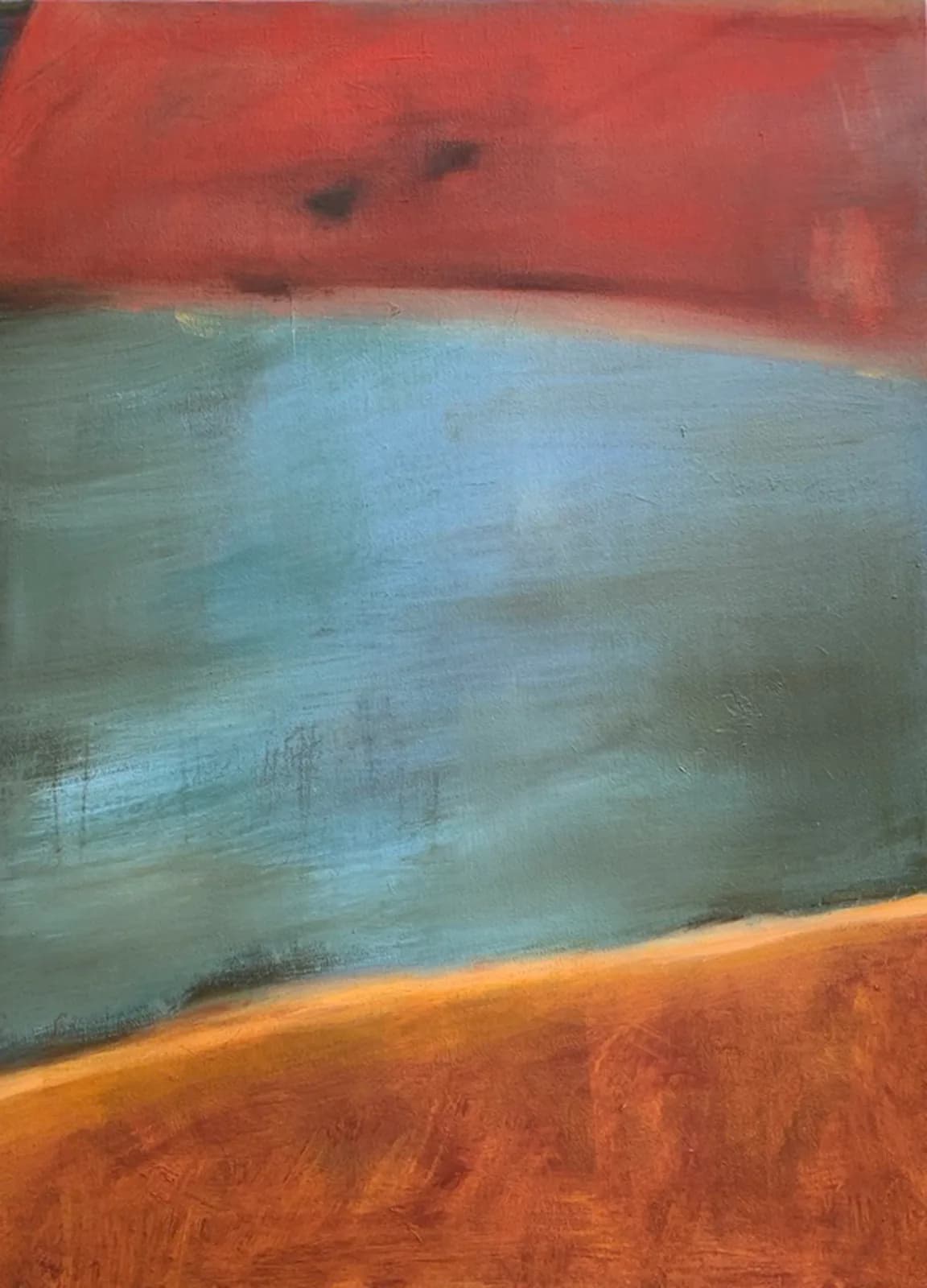 An abstract landscape painting in oil and acrylic features broad strokes of red, blue, and sandy brown.
