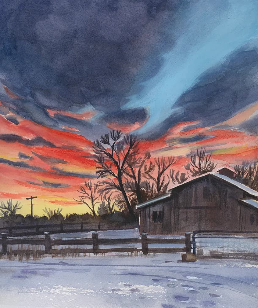 A watercolor painting captures a winter sunset with a stormy sky over a rustic barn and snow-covered ground.